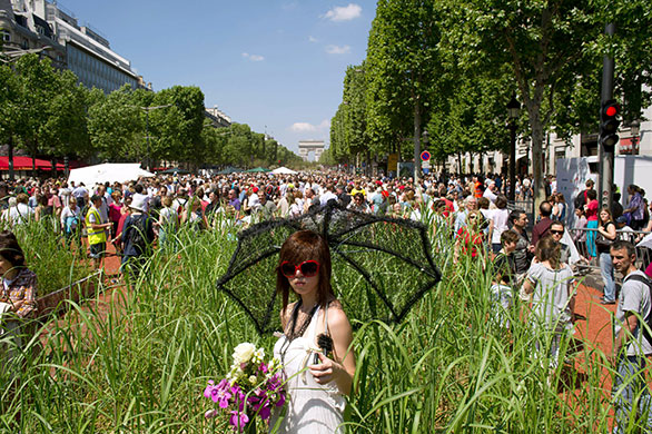 Champs-Elysees greenery: A model poses on the Champs-Elysees avenue