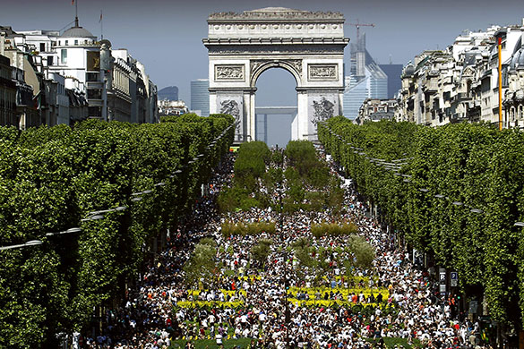 Champs-Elysees greenery: Visitors stroll on the Champs-Elysees avenue 