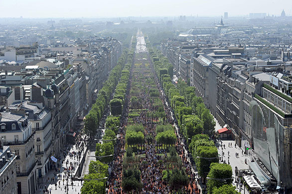 Champs-Elysees greenery: Visitors stroll on the Champs-Elysees avenue in Paris