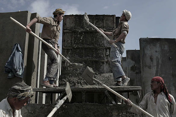 24 hours in pictures: Kabul, Afghanistan: Labourers work at a factory making concrete blast walls