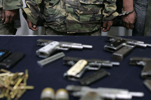 24 hours in pictures: members of the El Milenio drug cartel after their arrest in Mexico