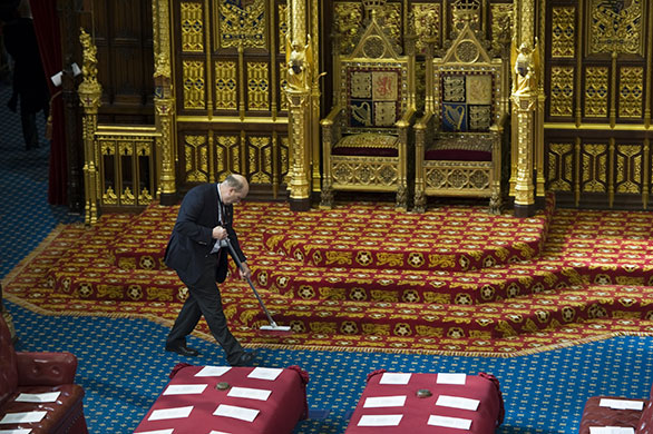 state opening: The carpet is cleaned in front of the Queen's throne in Westminster