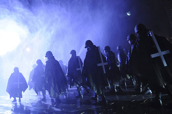 24 hours in pictures: Buenos Aires, Argentina: People, performing as veterans of Falklands' war