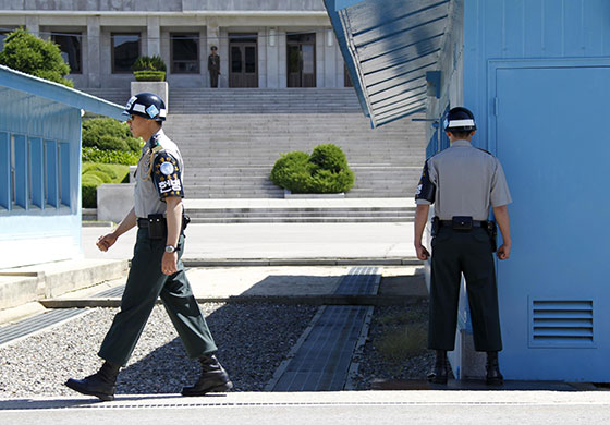 Korea crisis: North Korean soldier and South Korean soldiers in the demilitarised zone
