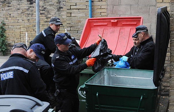 bradford murders: Police officers search through the red light district of Bradford 