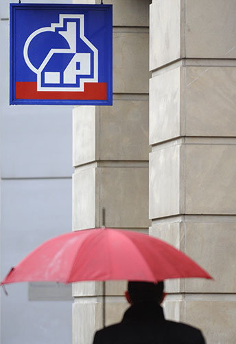 Week in Business: A man passes a branch of the Nationwide building society in central London