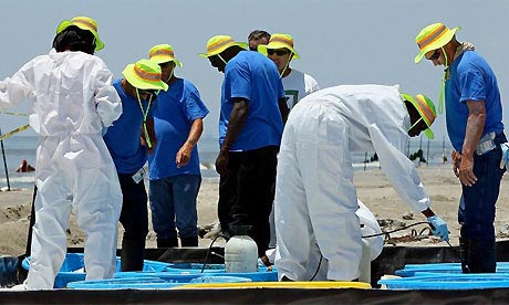 Oil spill, beach cleaners