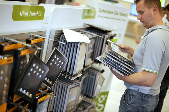 ipad launch: Berlin, Germany: A vendor arranges accessories for Apple's new iPad