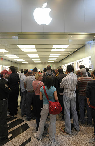 ipad launch: Milan, Italy: Customers queue to enter an apple store in Carugate