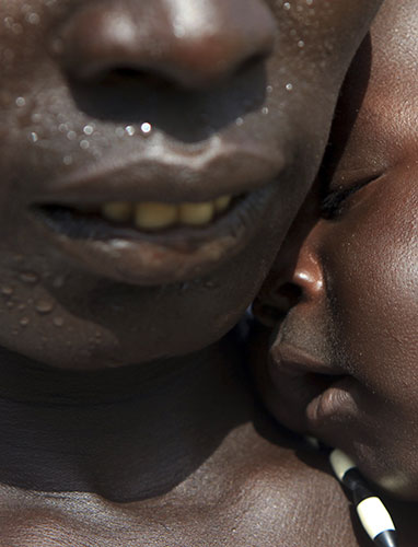 24 hours in pictures: A mother and child visit a nutrition center in Warrap town