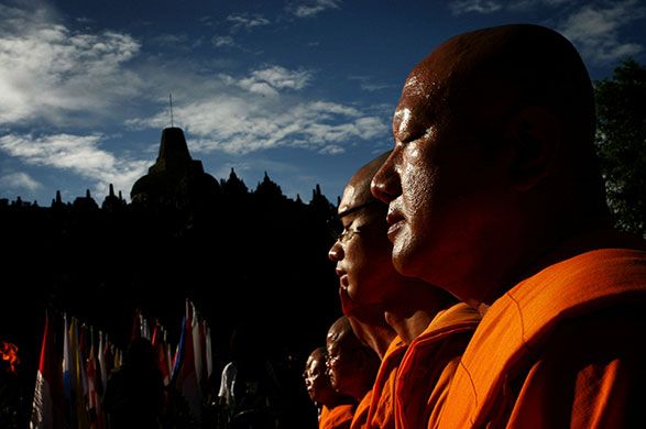 24 hours in pictures: Magelang, Indonesia:  Buddhist monks meditate at  Borobudur temple 