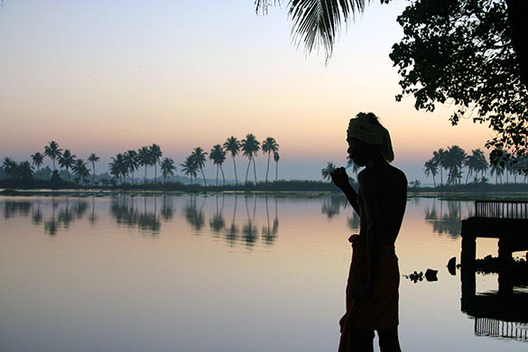 in pictures: morning: Man brushing his teeth in Kerala, India