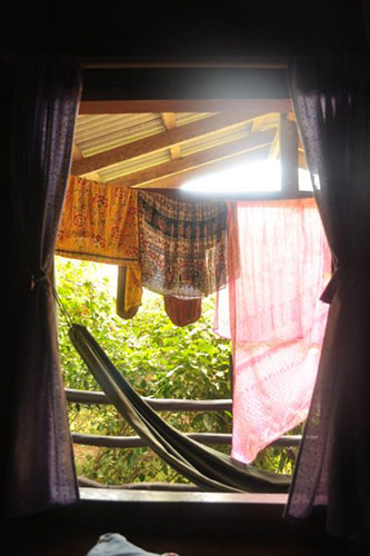 in pictures: morning: Washing hanging outside a hut in Thailand