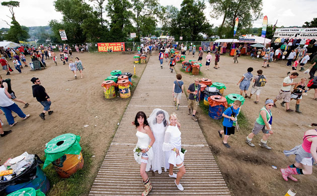 Glastonbury at 40: Revellers dressed as a wedding party pos