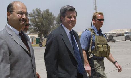 Paul Bremer, centre, at Baghdad International Airport in 2004.