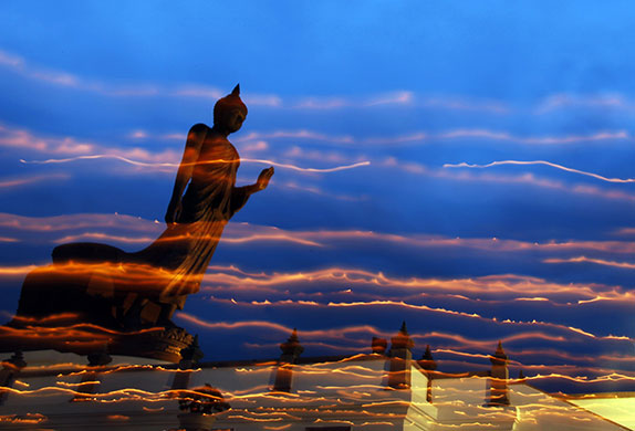 24 Hours in Pictures: Buddhists encircle a large Buddha statue during Vesak Day
