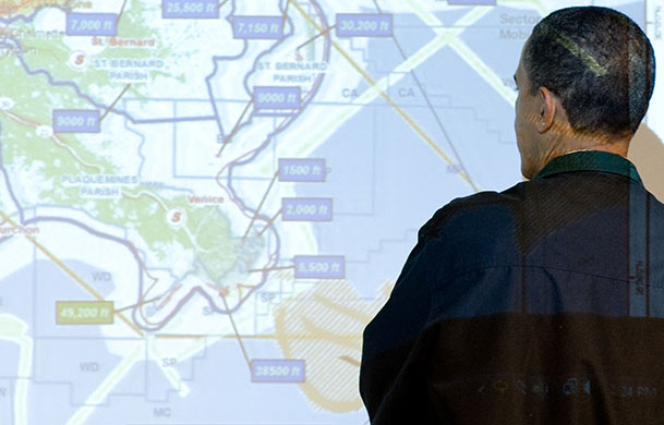 Deepwater Horizon oil rig: Oil spill : US President Barack Obama looks at a map