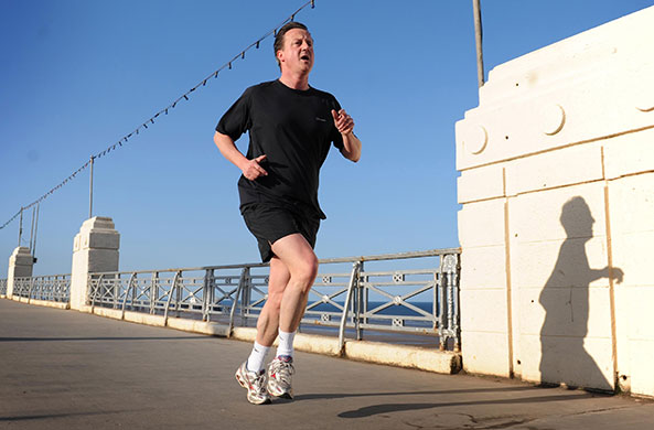 Election week five: Conservative Party leader David Cameron runs along the front in Blackpool