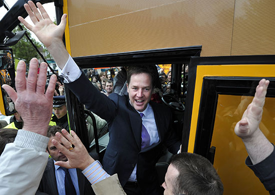 Election week five: Nick Clegg waves from his campaign bus as he leaves a rally in Blackheath