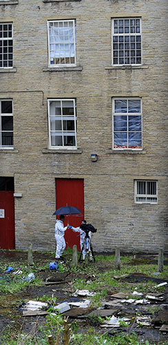 Bradford murders: Forensic officers work in the rear garden of the apartment of Griffiths