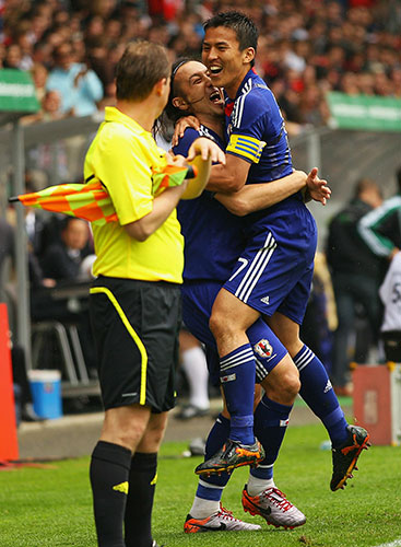 England v Japan: Marcus Tulio Tanaka and Makoto Hasebe celebrate a goal