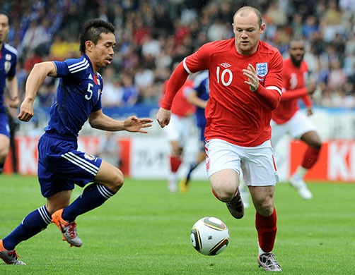 England v Japan: Wayne Rooney and Yuto Nagatomo run for the ball