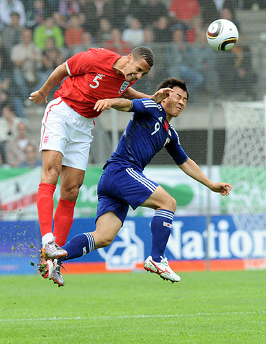 England v Japan: Rio Ferdinand vies with Shinji Okazaki