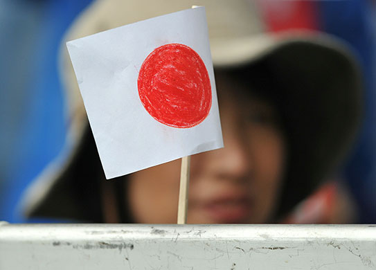 England v Japan: A Japanese fan holding a flag