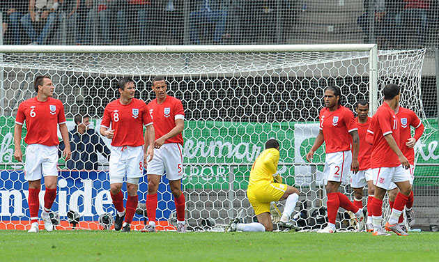 England v Japan: England players stand dejected after Marcus Tanaka scored