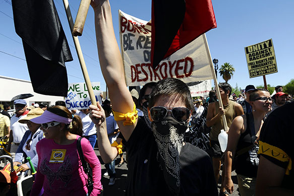 24 hours in pictures: Phoenix, US: Demonstrators march through the streets