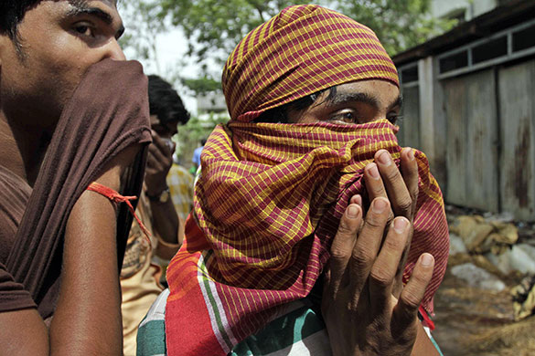 24 hours in pictures: Mednipur, India: Relatives of train accident victims