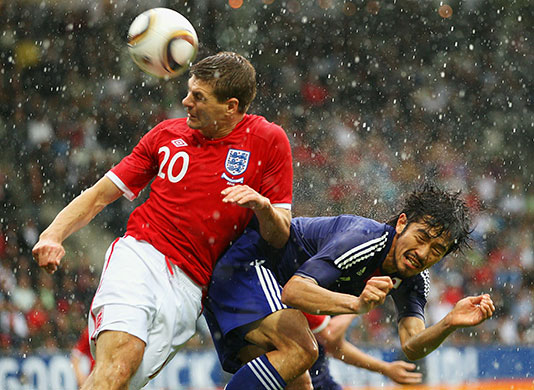 England v Japan friendly: Steven Gerrard and Yuki Abe compete for the ball