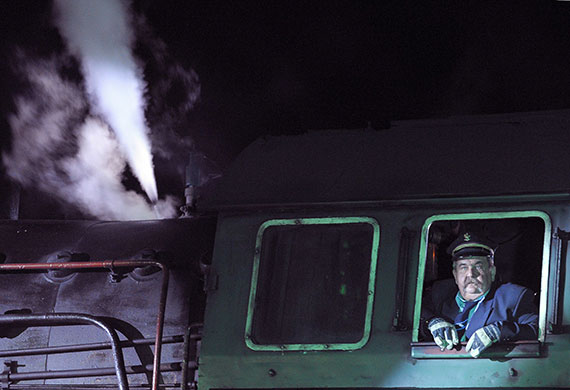 24 hours in pictures: Wolsztyn, Poland: The driver of an old steam locomotive