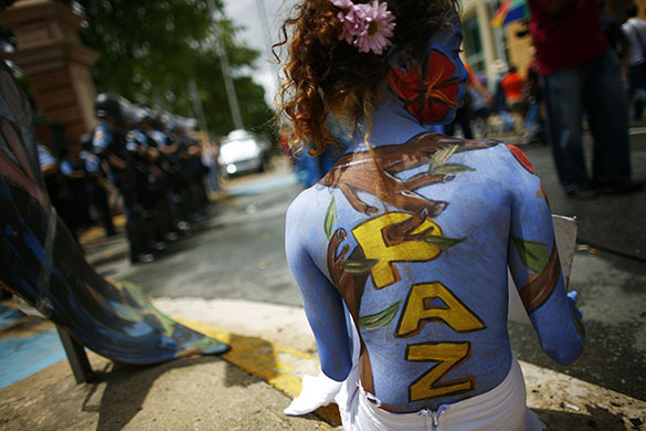24 hours in pictures: San Juan, Puerto Rico: A student protester during an ongoing strike