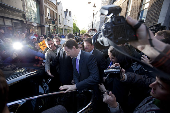 Campaigning with Clegg: Nick Clegg is mobbed by media in Richmond