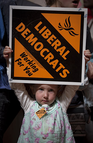 Campaigning with Clegg: A young girl holds a Liberal Democrat sign in Streatham