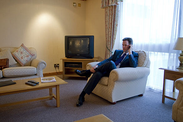 Campaigning with Clegg: Nick Clegg talks on the phone in a waiting room at Teeside airport
