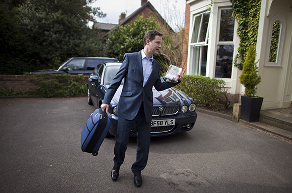 Campaigning with Clegg: Nick Clegg leaves his hotel in Manchester 
