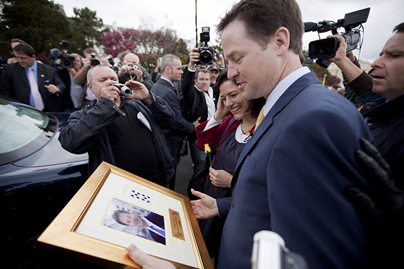 Campaigning with Clegg:  Nick Clegg is handed a picture he'd signed for charity in Eastbourne