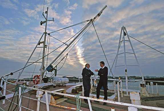 Cameron's 24 hours: David Cameron talks to a fisherman at Grimsby docks