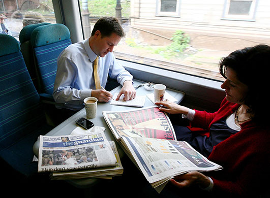 Daily election: Nick Clegg onboard a train with his wife Miriam Gonzalez Durantez