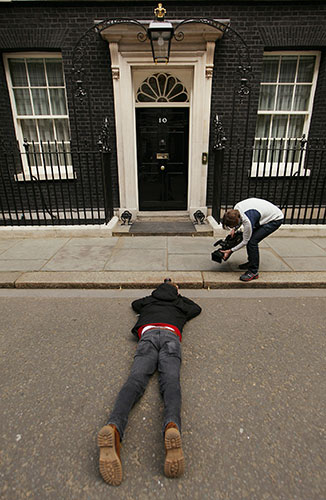 Daily election 2: A photographer lies down at the Door of Number 10 Downing Street 