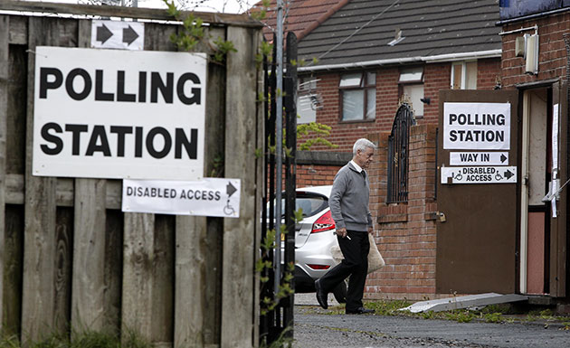 Polling: A voter arrives at the Reigate Social Club in  Halewood, Knowsley