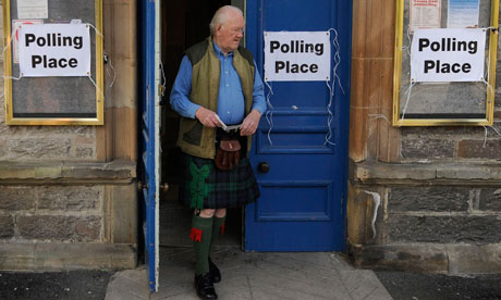 Voter leaves a polling station in Pitlochry, Scotland