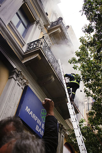 Greece Rioting: Firemen rescue bank employee's of the Marfin-Egnatia Bank in Athens