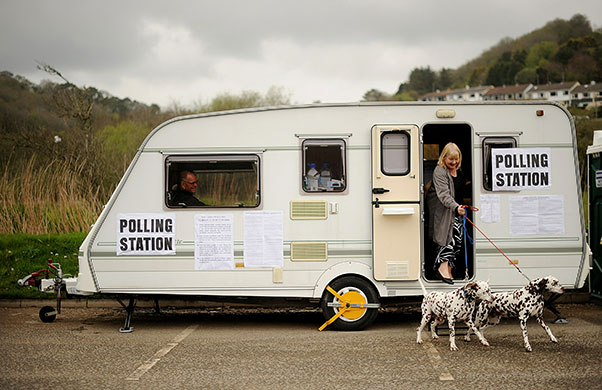 Voting updated: A woman votes in a caravan in cornwall