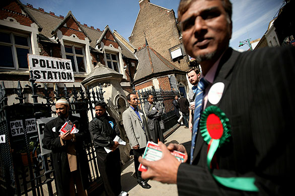 Voting updated: Respect party members canvas outside a polling station on Brick Lane