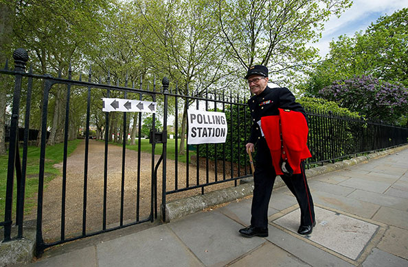 Voting updated: A Chelsea Pensioner makes his way towards a polling station in west London