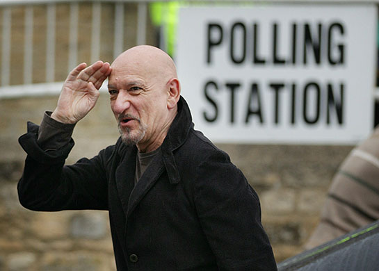 Voting updated: Ben Kingsley gestures as he arrives at the polling station in Spelsbury