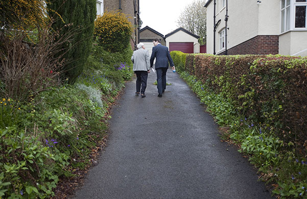 Clegg on polling day: Lib Dem leader Nick Clegg walks up the path of his home